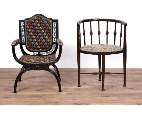 A late 19th/early 20th Century aesthetic period ebonized occasional chair, with pierced fretwork backrest, with tapestry flor