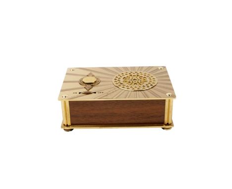 A Swiss brass music box, ‘The Rhapsody’, with clockwork movement, 12cms wide, with leaflet and box.