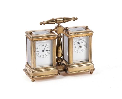 An early 20th Century brass cased clock and barometer desk compendium, the glazed twin cases enclosing white enamel dials, fi