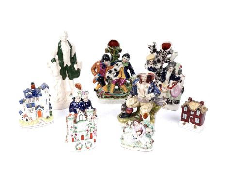 A selection of Staffordshire figures and vases, including: a Staffordshire flatback figure of Robert Burns, 34cms high; a Sta
