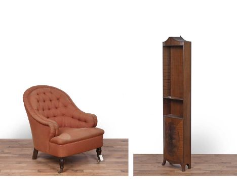 A Victorian style button back tub armchair, raised on turned beech legs to the front terminating in brass castors, 80 x 90 x 