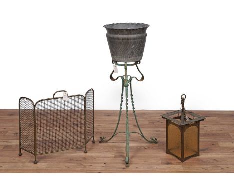 An ornate vintage wrought and embossed metal jardiniere on stand, 115cms high; a vintage brass lantern, with four opaque glaz