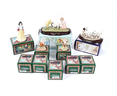 A set of Royal Doulton Walt Disney's Classic Snow White and the Seven Dwarfs ceramic figures, each in box; together with two 