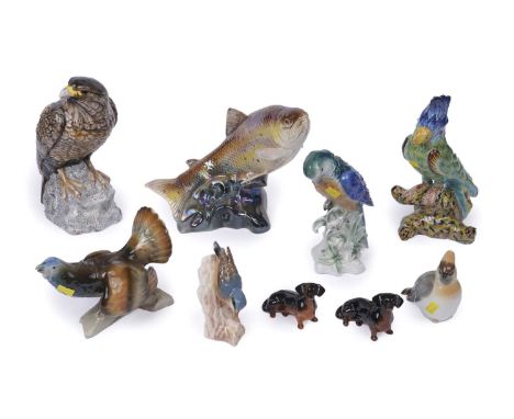A selection of ceramic figures of birds, including: a Leonardo figure of an eagle, 28cms high; a Royal Dux figure of a caperc