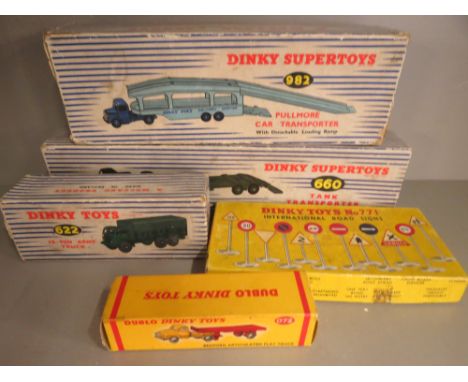 A Dinky Dublo flat truck, Army truck, tank transporter, road signs and a Pullmore transporter, all boxed