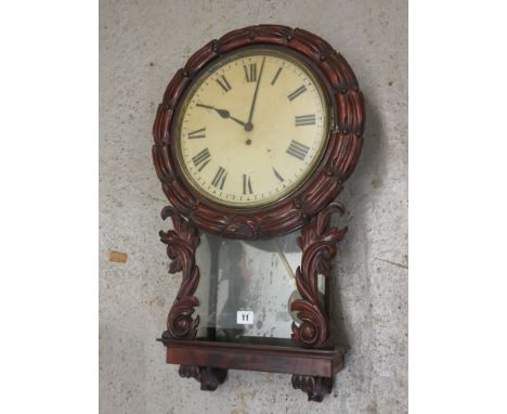 Victorian carved mahogany cased wall hanging dial clock, with glazed pendulum aperture, fusee movement, white enamel 12 Roman
