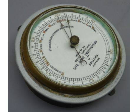 Circular metal cased 'Fishermans Aneroid Barometer' issued by the Royal National Life Boat Institution, with brass bezel, by 