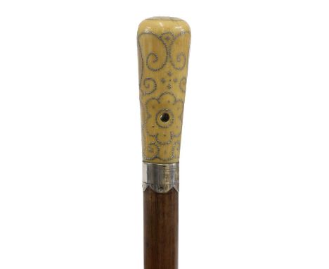 A Queen Anne ivory and piqué work walking stick, the tapering cylindrical handle with scrolling floral and foliate decoration