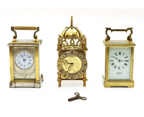 Three brass carriage clocks, one with a printed enamel dial, engraved face and plated details, 13cm high, one with a dial ins