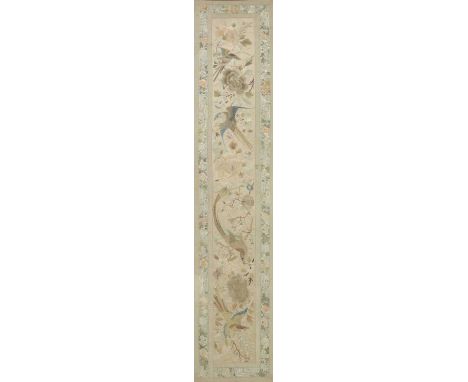 A Chinese embroidered silk panel, 20th century, decorated with pheasants among peony, magnolia and other flowers, within a fl
