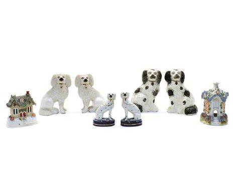 Two pairs of Staffordshire ceramic painted spaniels, late 19th century and two pastille burners, 19th century, 2 sporting dog