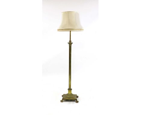 A 19th century brass oil lamp standard, with adjustable classical column, on a stepped square base, claw and ball feet, conve