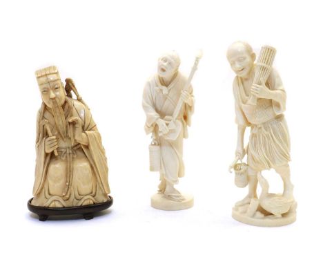 A Chinese ivory figure, late 19th century, of Lü Dongbin seated on rocks, holding a flywhisk in his right hand and carrying a