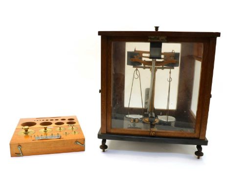 A mahogany cased set of Oertling chemical balance scales, model 52F.M, 36.5cm wide, 27cm deep, 42cm high, together with a mah
