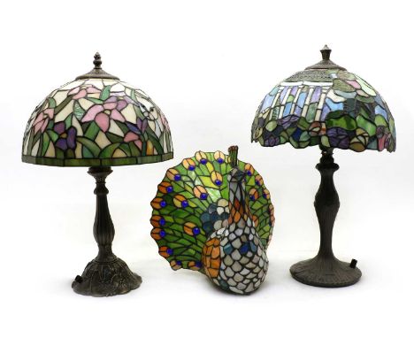 A Tiffany style table lamp, the shade decorated with flowers and cats, 48cm high, together with a similar example, with pergo