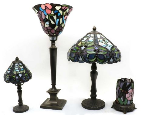 A Tiffany style table lamp, with flared shade, 57.5cm high, together with another lamp with floral decoration, 46cm high, a m