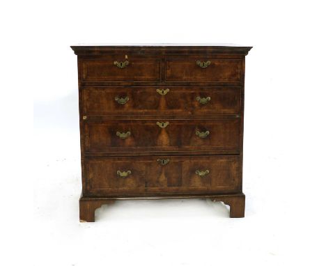 An early 18th century walnut chest of drawers, c.1745, with feather banded decoration on square bracket feet, 98cm wide, 54cm