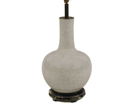 A Chinese-style crackle-glazed ceramic table lamp, 20th century, of tianqiuping shape, on an integral pierced hardwood stand,