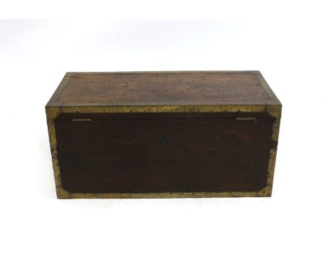 A teak and brass bound trunk, 19th century, with recessed carrying handles, 'VR' cypher on the lock, key present and works, 9