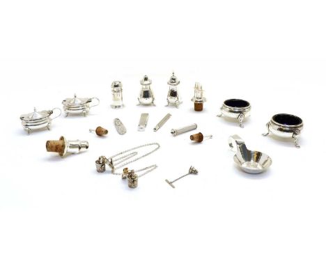 A matched silver four piece condiment set, a pair of silver circular salts, a pepperette, a silver three piece pipe set, a Ge