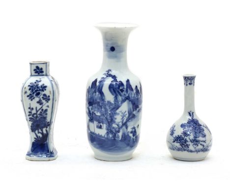 Three small Asian blue and white vases, including a rouleau shaped example decorated in underglaze blue with a mountaineous s