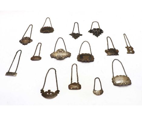 Fourteen decanter labels, nine silver: two sherry, claret, Holland, port, Burgundy, whisky, one blank and one illegible, five