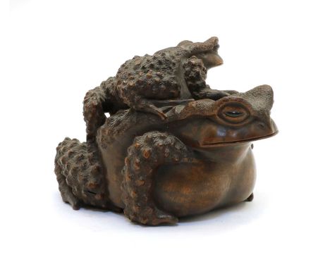 A Japanese wood okimono, 20th century, of a toad, with a smaller toad on its back, signed Masanao, 15cm long Provenance: an E