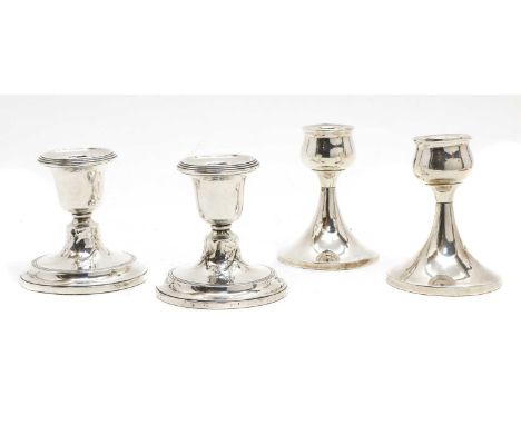 Two pairs of silver candlesticks, by Sydney &amp; Co. and William Adams Ltd., Birmingham 1915 and 1953, one pair of bulbous f