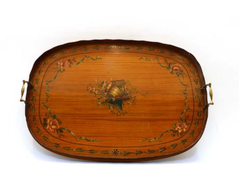 An Edwardian painted satinwood veneered galleried tray, with two brass handles, decorated with a central musical trophy group