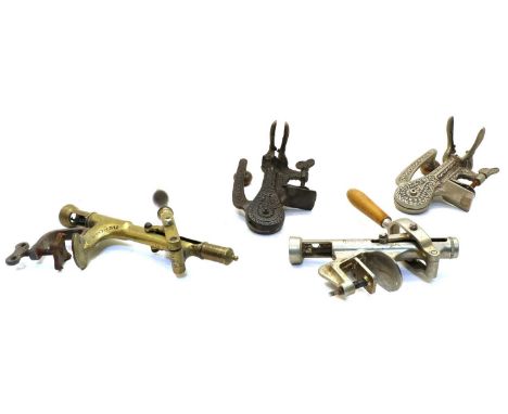 Four bar top cork pullers: the first brass no. 13143 'The Merritt'; the second and third 'The Safety' with cast decoration, t