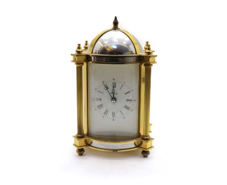 An Angelus brass mantel clock, of cylindrical shape, striking on a bell, 22cm highProvenance: From the collection of the late