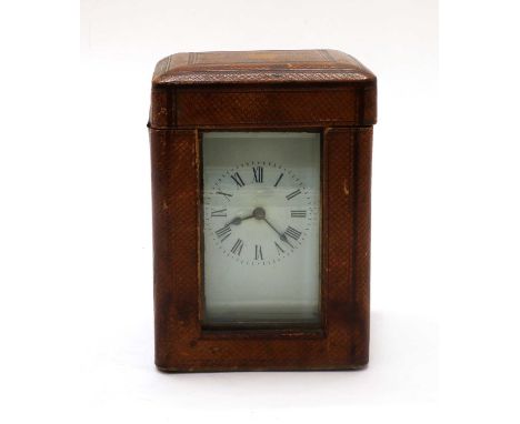 A brass carriage clock, impressed 'R & Co', complete with leather travelling case and key, clock 11.5cm highProvenance: From 