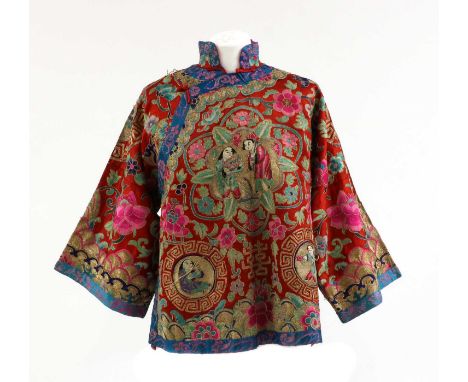 A Chinese embroidered jacket, 20th century, the centre decorated He He Erxian in a shaped panel, surrounded by with peonies, 