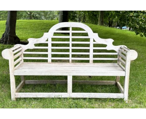 LUTYENS STYLE GARDEN BENCH, well weathered teak after the design by Sir Edwin Lutyens with arched back and scroll arms. 