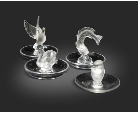 Lalique, a group of four frosted and polished glass cendriers, to include a raptor, 6cm high; a dove in flight, 10cm high; a 
