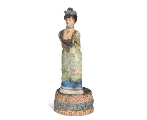 § Quentin Bell (1910-1996), a studio pottery model of a woman, painted in colourful glazes and mounted to integral circular b