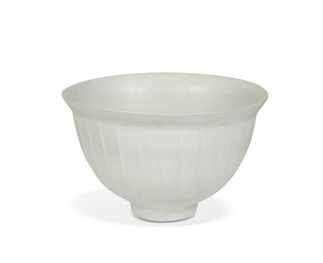 § David Leach (1911-2005), a cut-sided bowl, the porcelain body glazed in white, embellished with fluted sides and slightly e