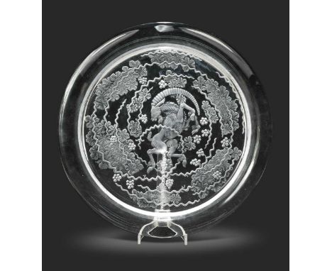 Berbere, a Lalique frosted and polished glass charger, etched to the underside with rampant goat and fruiting vine decoration