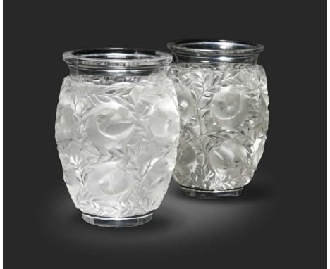 Bagatelle, two Lalique glass vases, each modelled in relief with a repeating pattern of birds nesting amongst foliage, one in