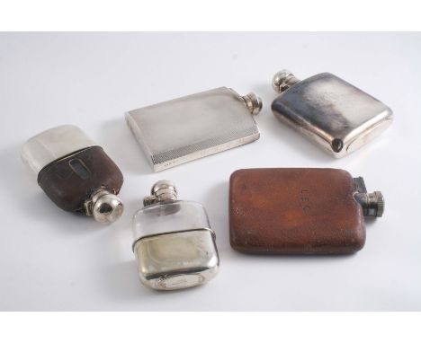 SPIRIT FLASKS: An engine-turned example, a plain example, monogrammed & dated "Sept 3rd 1938", a Victorian mounted glass exam