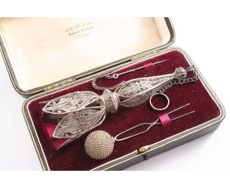 A LATE 19TH CENTURY FILIGREE WORK POSY HOLDER with suspensory ring & chain and a hair pin with a ball finial (both contained 