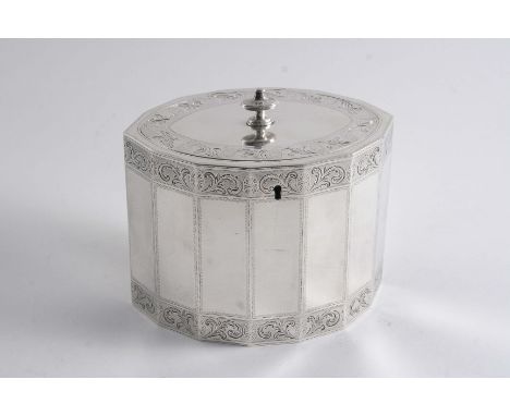 A GEORGE III NAVETTE-SHAPED TEA CADDY with multi-panelled sides and bright engraved friezes around the cover & upper & lower 