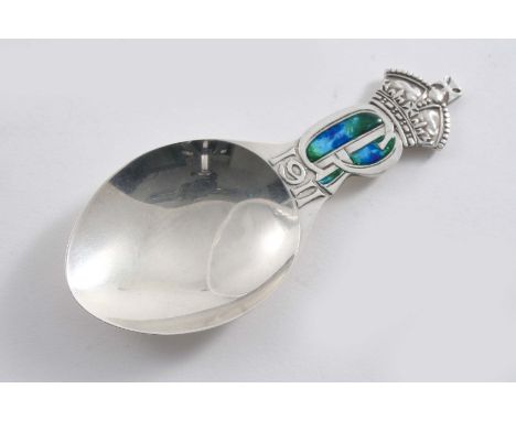 A CADDY SPOON to commemorate the "Coronation of King George V 1911", decorated with a blue/green resin on the stem, by Libert