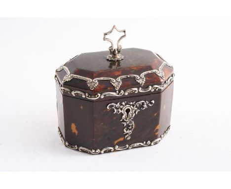 A MOUNTED TORTOISESHELL TEA CADDY  of panelled & canted oblong form with a hinged cover, internal cover & swing finial, by R.