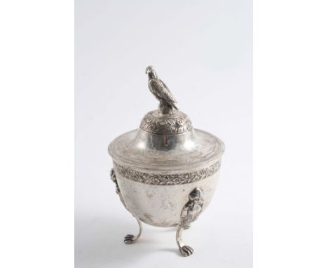 AN EARLY 19TH CENTURY ITALIAN SUGAR VASE & COVER with bird finial & chased floral borders, resting on three caryatid & foliat