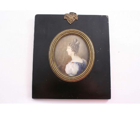 A MINIATURE PORTRAIT  of a young lady with a blue & white dress, wearing her hair in ringlets in a brass mounted, black paint