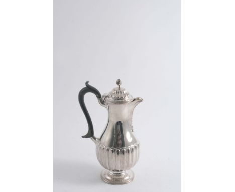 A LATE VICTORIAN PART-FLUTED HOT WATER JUG of baluster form with a wrythen knop finial, by Charles Stuart Harris, London 1899