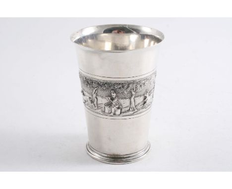 A 20TH CENTURY INDIAN BEAKER with an embossed band around the middle depicting hunting scenes, stamped underneath "SILVER" & 