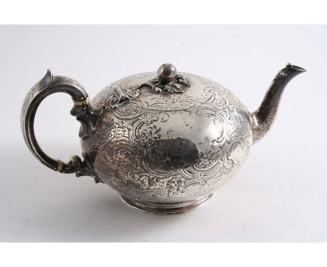 A VICTORIAN ENGRAVED TEA POT of squat circular form with a C-scroll handle, circular foot & a melon finial, vacant cartouches