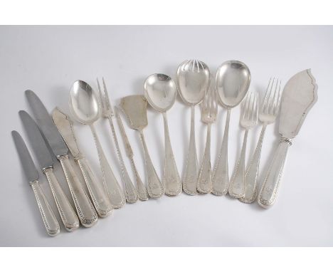 A 20TH CENTURY CONTINENTAL MATCHED PART CANTEEN OF FLATWARE & CUTLERY INCLUDING: Six table spoons, nine table forks, nine des